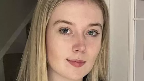 Headshot of Charlotte Phillips, young woman with long straight blond hair looking into the camera